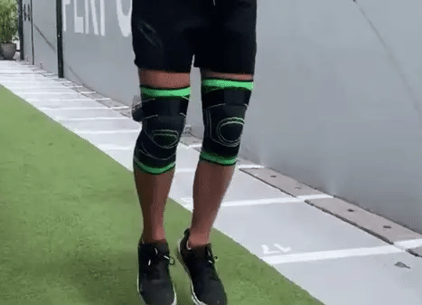 Rodillera deportiva de compresión con soporte lateral